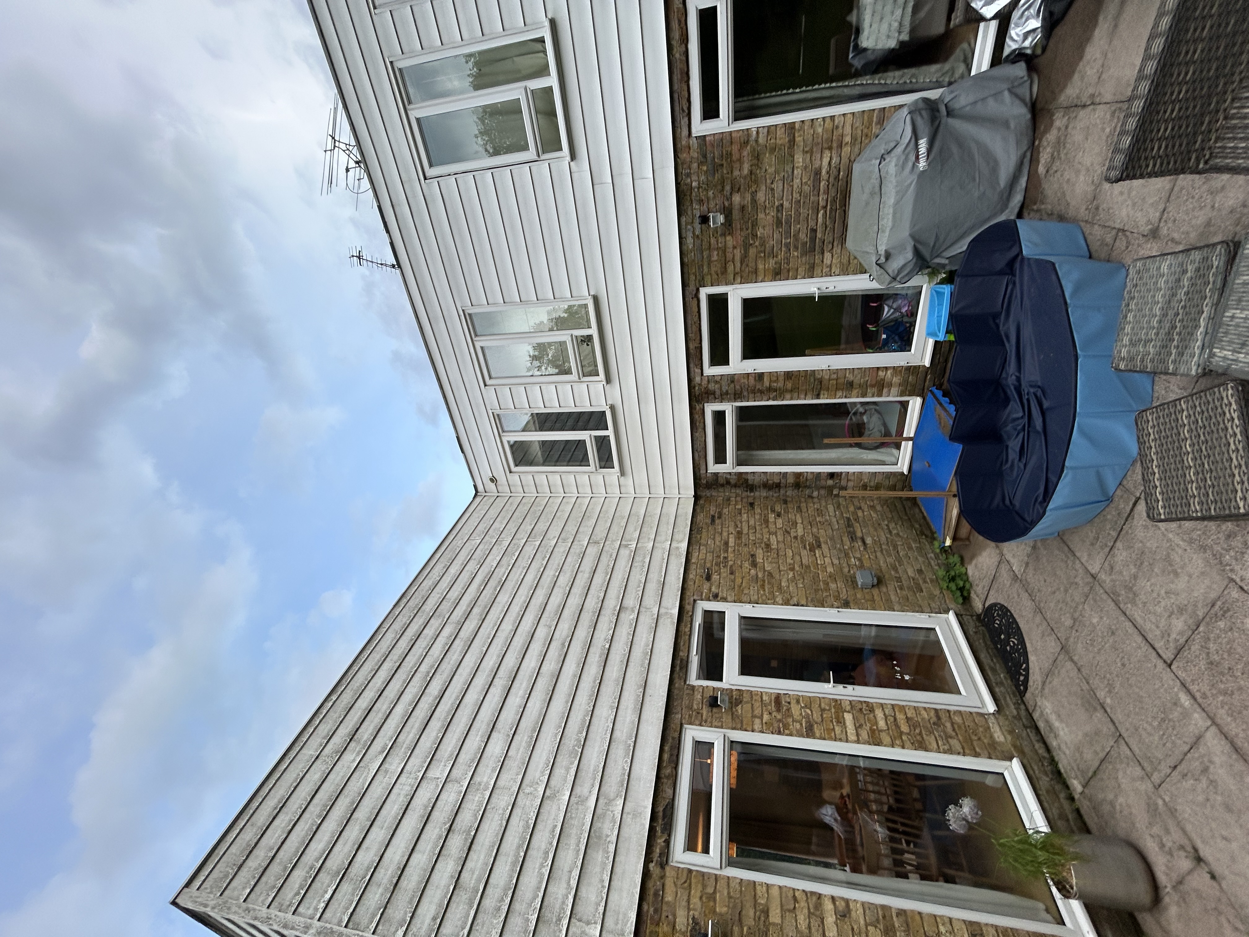 Clean house exterior after full window clean